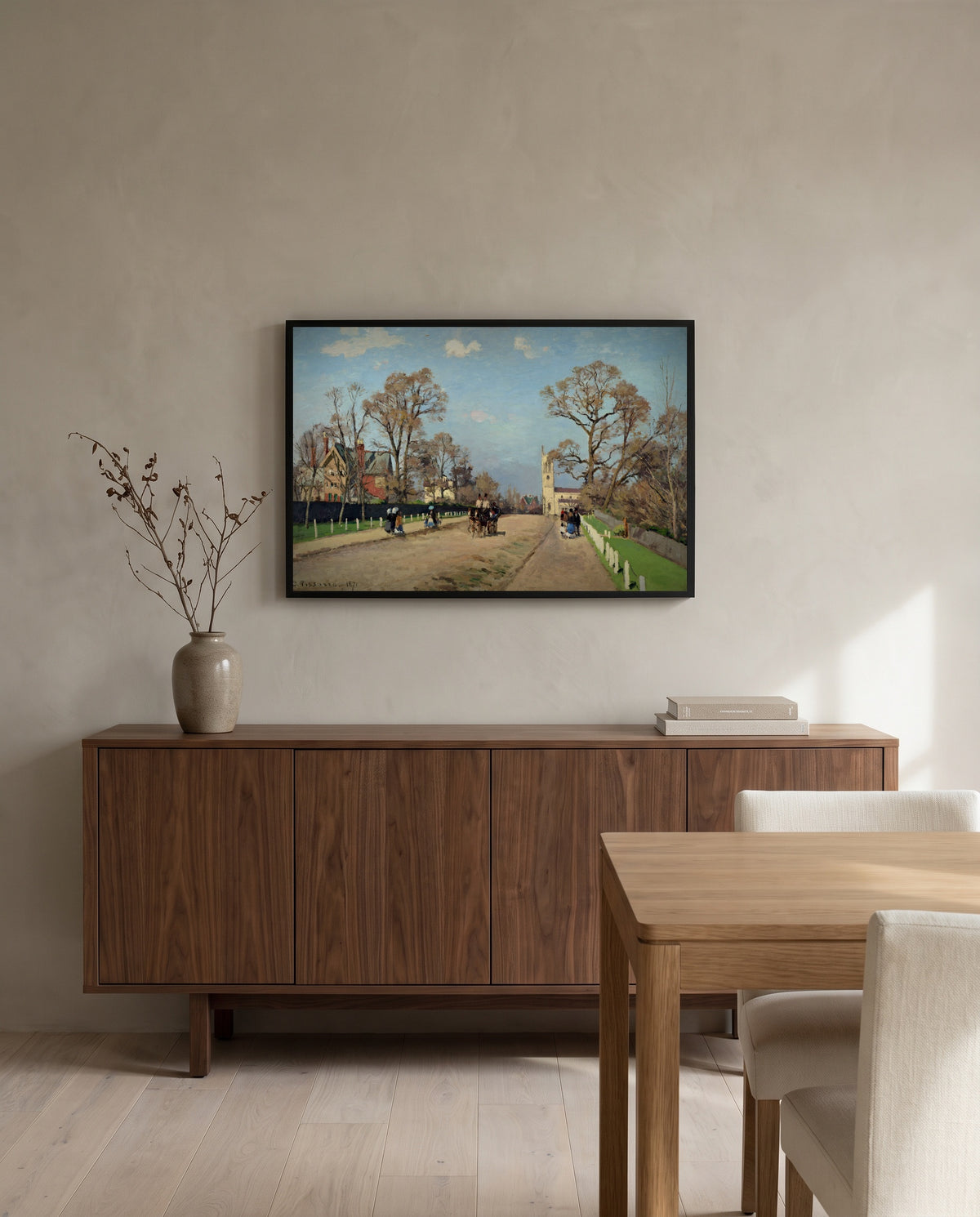 The Avenue, Sydenham by Camille Pissarro in a black frame above a walnut sideboard in a dining room