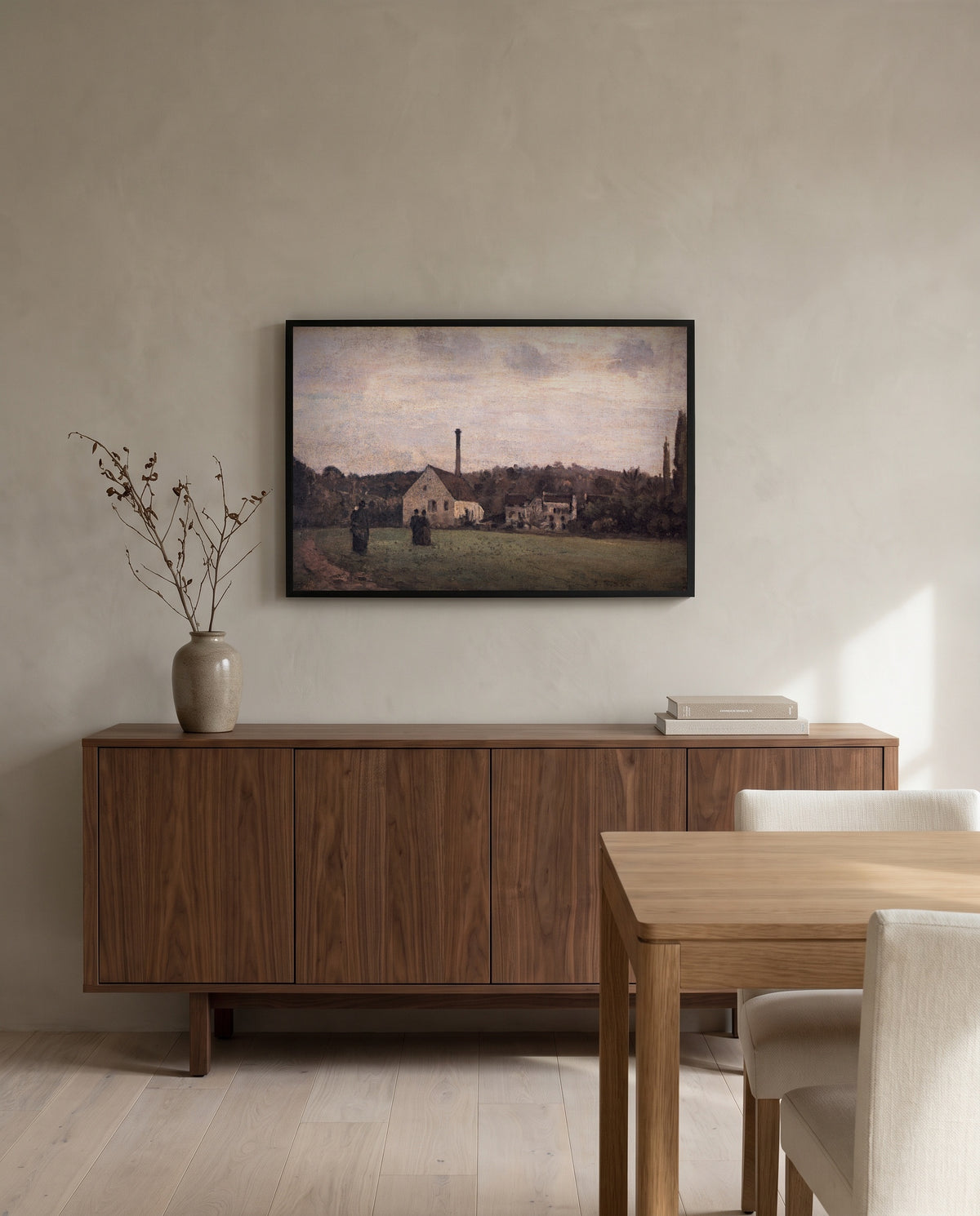 The Little Factory by Camille Pissarro in a black frame above a walnut sideboard in a dining room