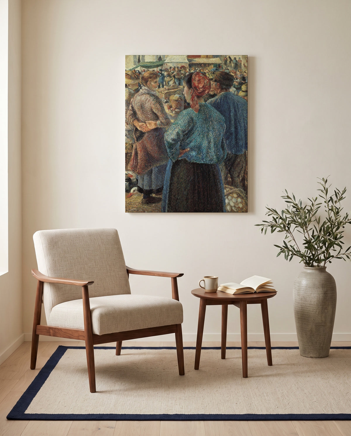 Poultry Market, Pontoise by Camille Pissarro as a stretched canvas above a linen lounge chair in a reading corner