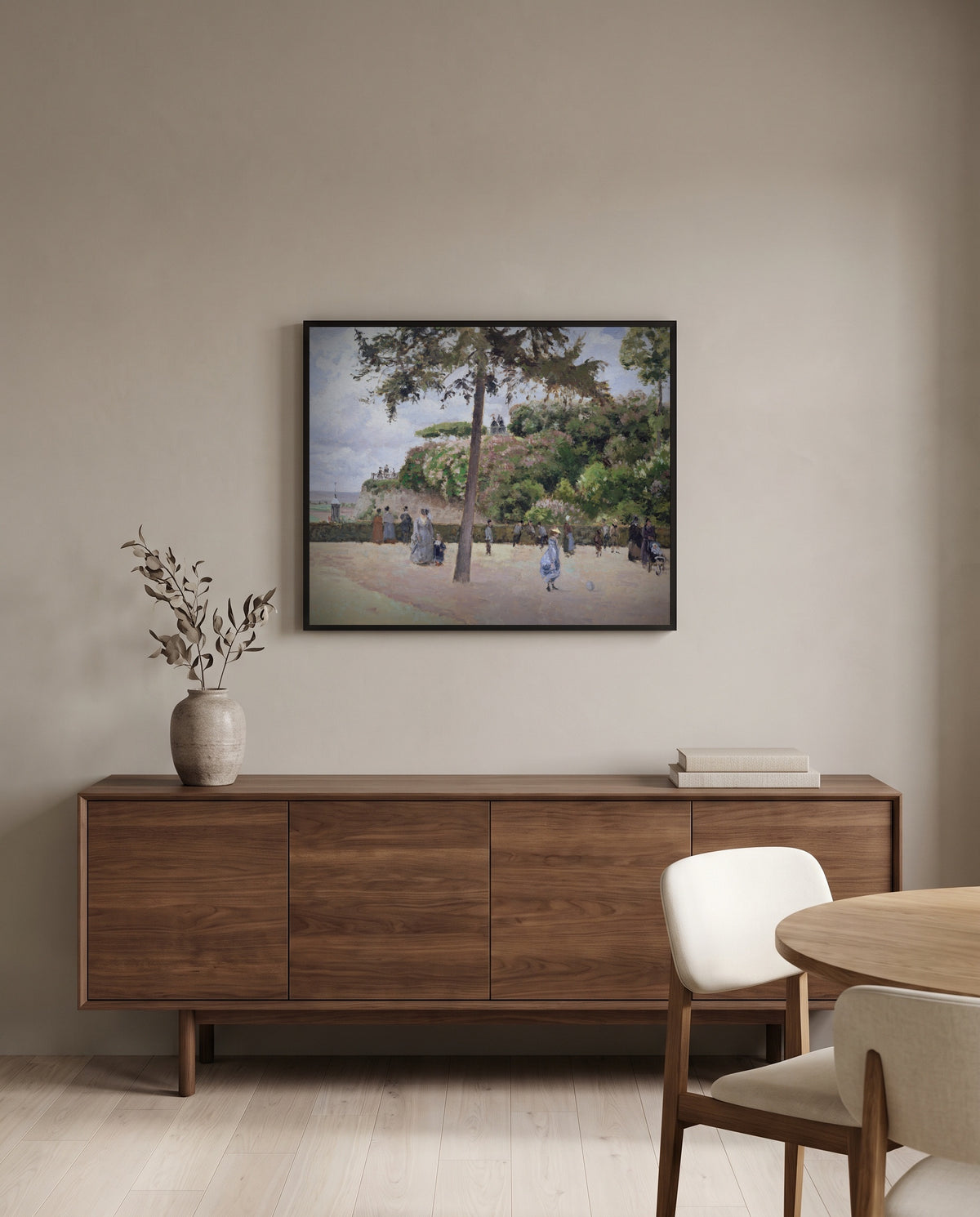 Public Garden, Pontoise by Camille Pissarro in a black frame above a walnut sideboard in a dining room