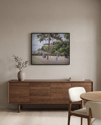 Public Garden, Pontoise by Camille Pissarro in a black frame above a walnut sideboard in a dining room
