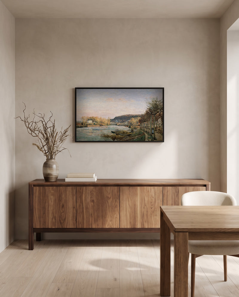 The Seine at Bougival by Camille Pissarro in a black frame above a walnut sideboard in a dining room