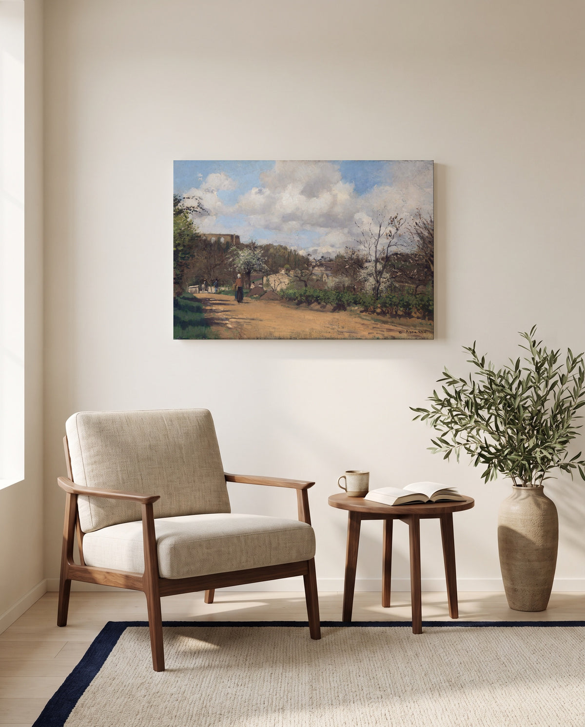 View from Louveciennes by Camille Pissarro as a stretched canvas above a linen lounge chair in a reading corner