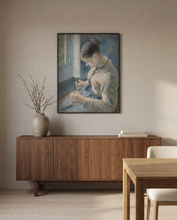 Young Peasant with Coffee by Camille Pissarro in a black frame above a walnut sideboard in a dining room