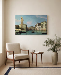 Entrance to the Cannaregio by Canaletto as a stretched canvas above a linen lounge chair in a reading corner