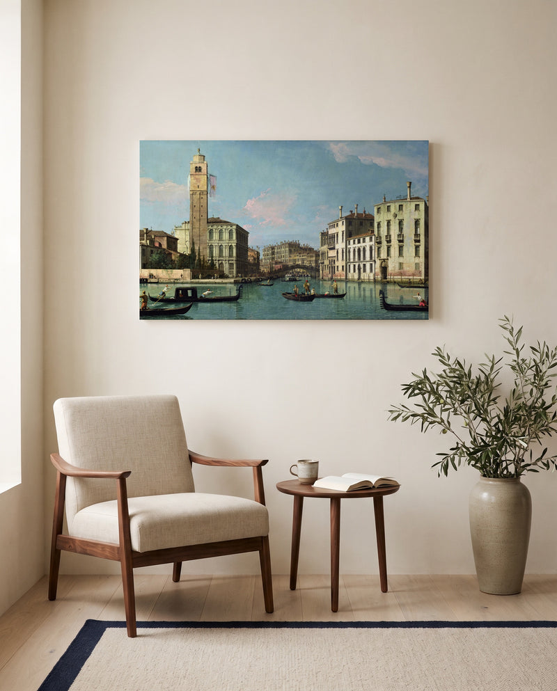 Entrance to the Cannaregio by Canaletto as a stretched canvas above a linen lounge chair in a reading corner