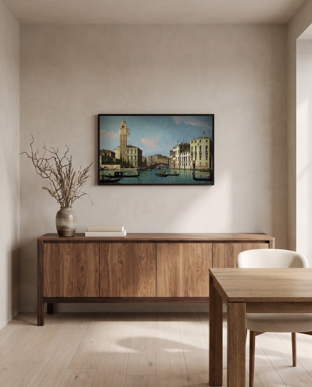 Entrance to the Cannaregio by Canaletto in a black frame above a walnut sideboard in a dining room