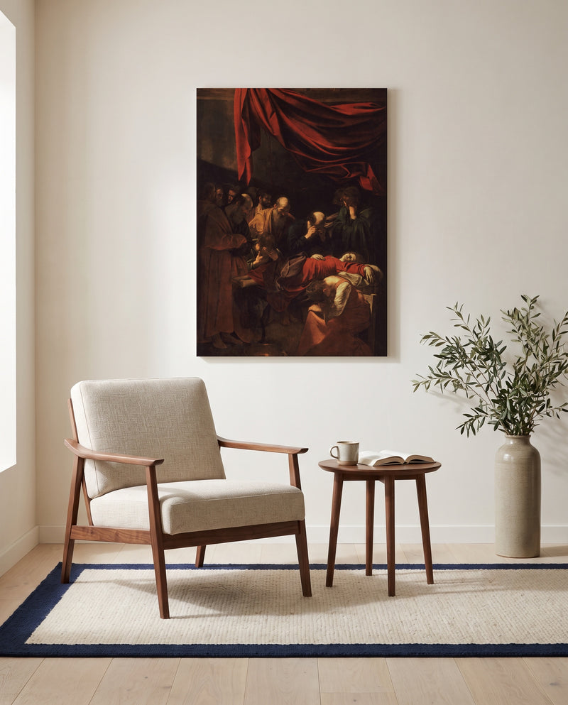 Death of the Virgin by Caravaggio as a stretched canvas above a linen lounge chair in a reading corner