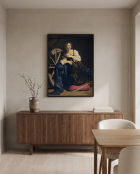 Saint Catherine by Caravaggio in a black frame above a walnut sideboard in a dining room