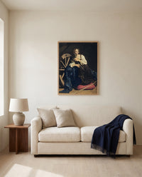 Saint Catherine by Caravaggio framed in natural oak above a cream sofa in a warm living room