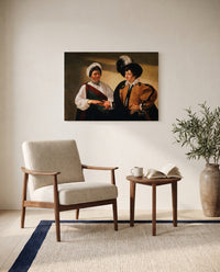 The Fortune Teller by Caravaggio as a stretched canvas above a linen lounge chair in a reading corner