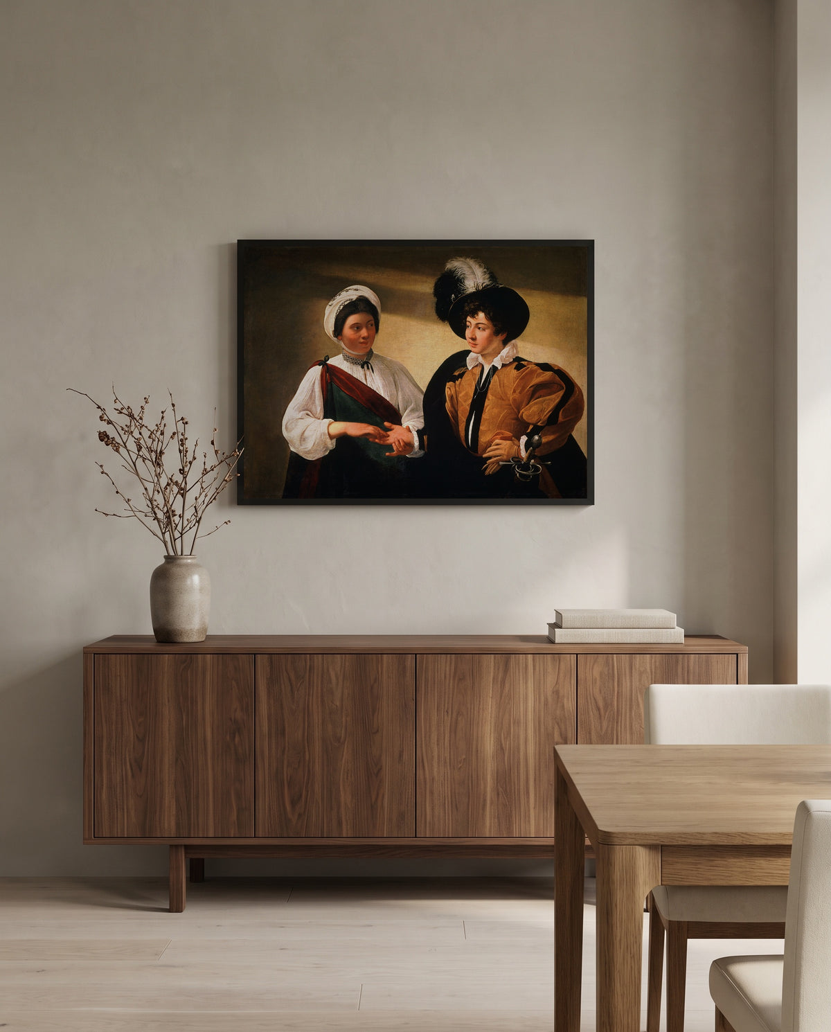 The Fortune Teller by Caravaggio in a black frame above a walnut sideboard in a dining room