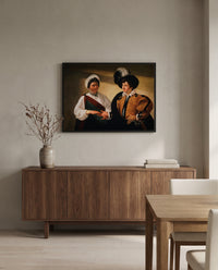 The Fortune Teller by Caravaggio in a black frame above a walnut sideboard in a dining room