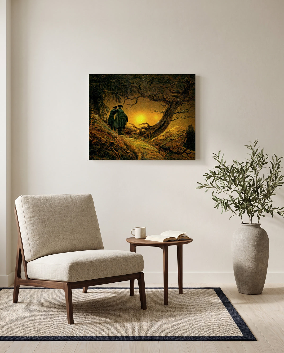 Two Men and the Moon by Caspar David Friedrich as a stretched canvas above a linen lounge chair in a reading corner