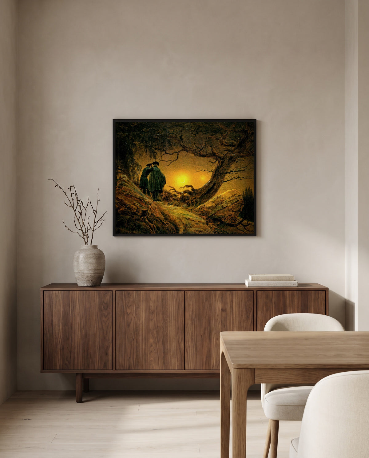Two Men and the Moon by Caspar David Friedrich in a black frame above a walnut sideboard in a dining room
