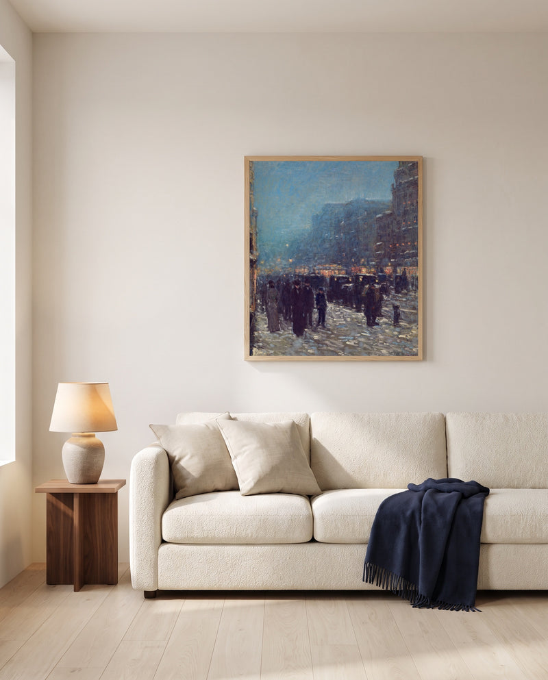 Broadway and 42nd Street by Childe Hassam framed in natural oak above a cream sofa in a warm living room