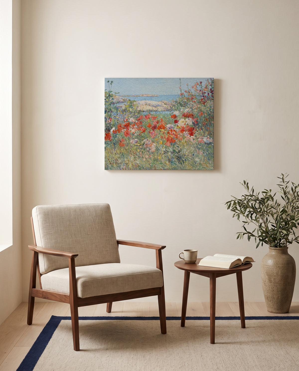Celia Thaxter’s Garden by Childe Hassam as a stretched canvas above a linen lounge chair in a reading corner