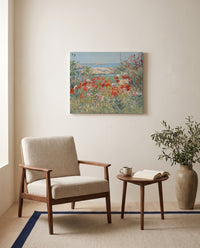 Celia Thaxter’s Garden by Childe Hassam as a stretched canvas above a linen lounge chair in a reading corner