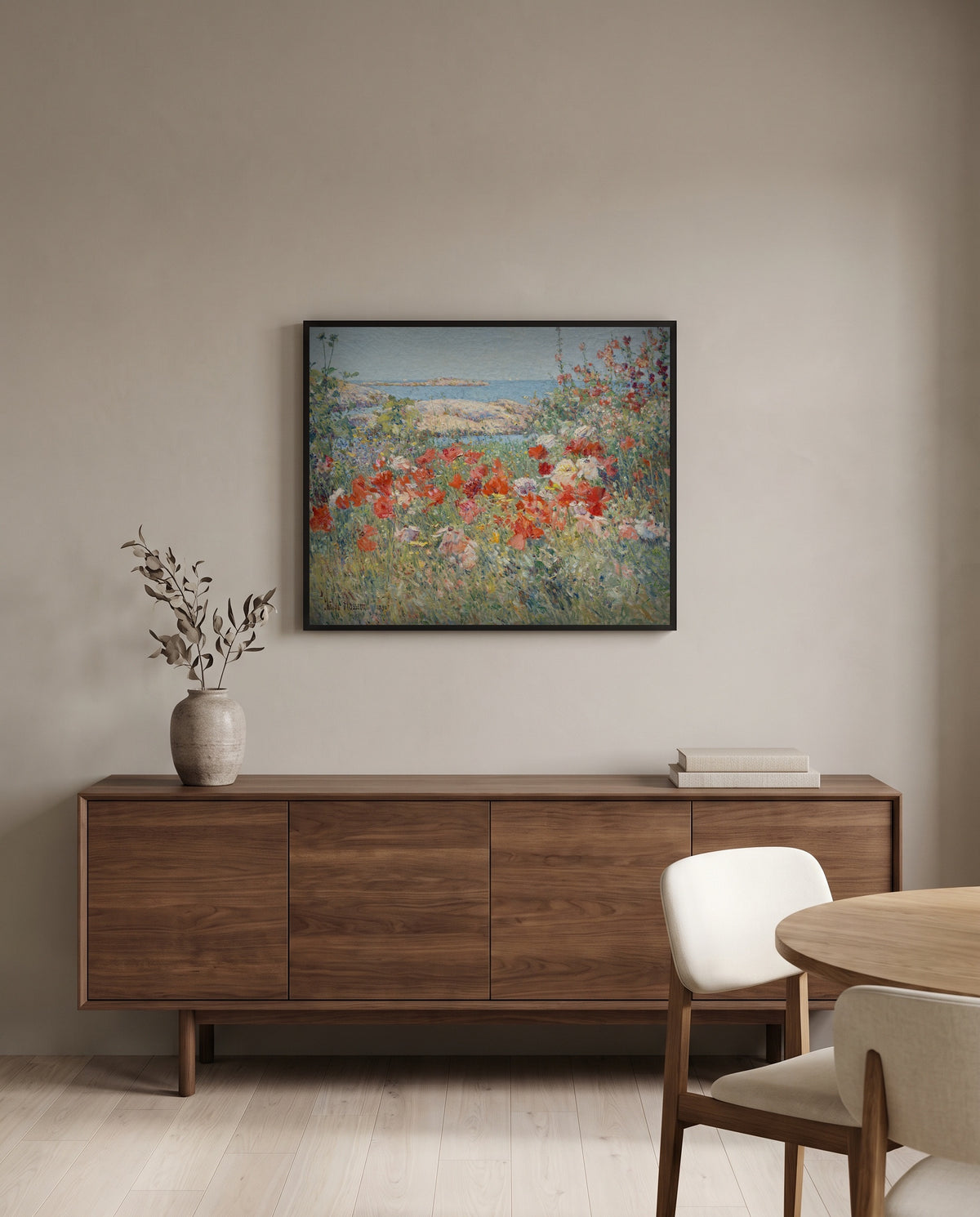 Celia Thaxter’s Garden by Childe Hassam in a black frame above a walnut sideboard in a dining room