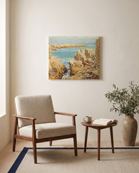 Coast Scene, Isles of Shoals by Childe Hassam as a stretched canvas above a linen lounge chair in a reading corner