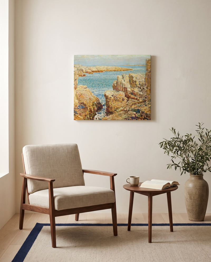 Coast Scene, Isles of Shoals by Childe Hassam as a stretched canvas above a linen lounge chair in a reading corner