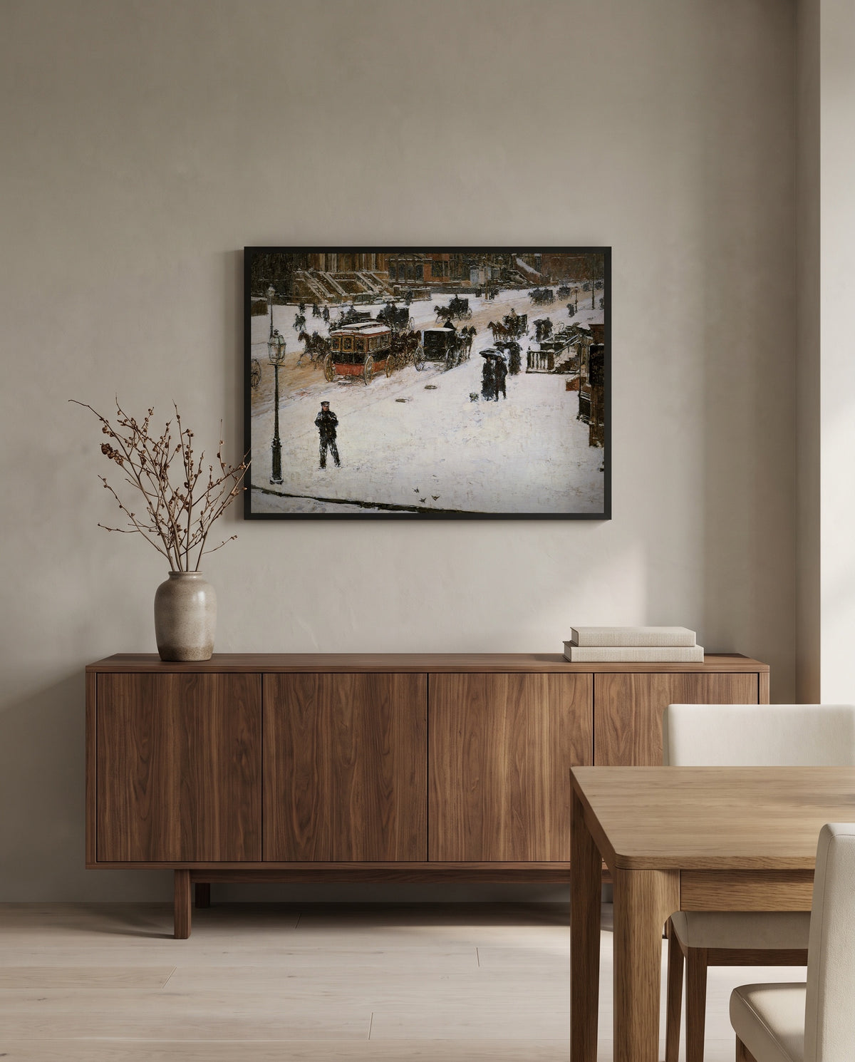 Fifth Avenue in Winter by Childe Hassam in a black frame above a walnut sideboard in a dining room