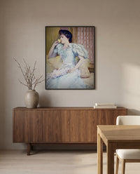 Lillie Langtry by Childe Hassam in a black frame above a walnut sideboard in a dining room