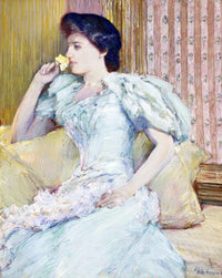 Lillie Langtry by Childe Hassam: a woman in a pale blue gown with white fur on a yellow sofa, holding a yellow rose