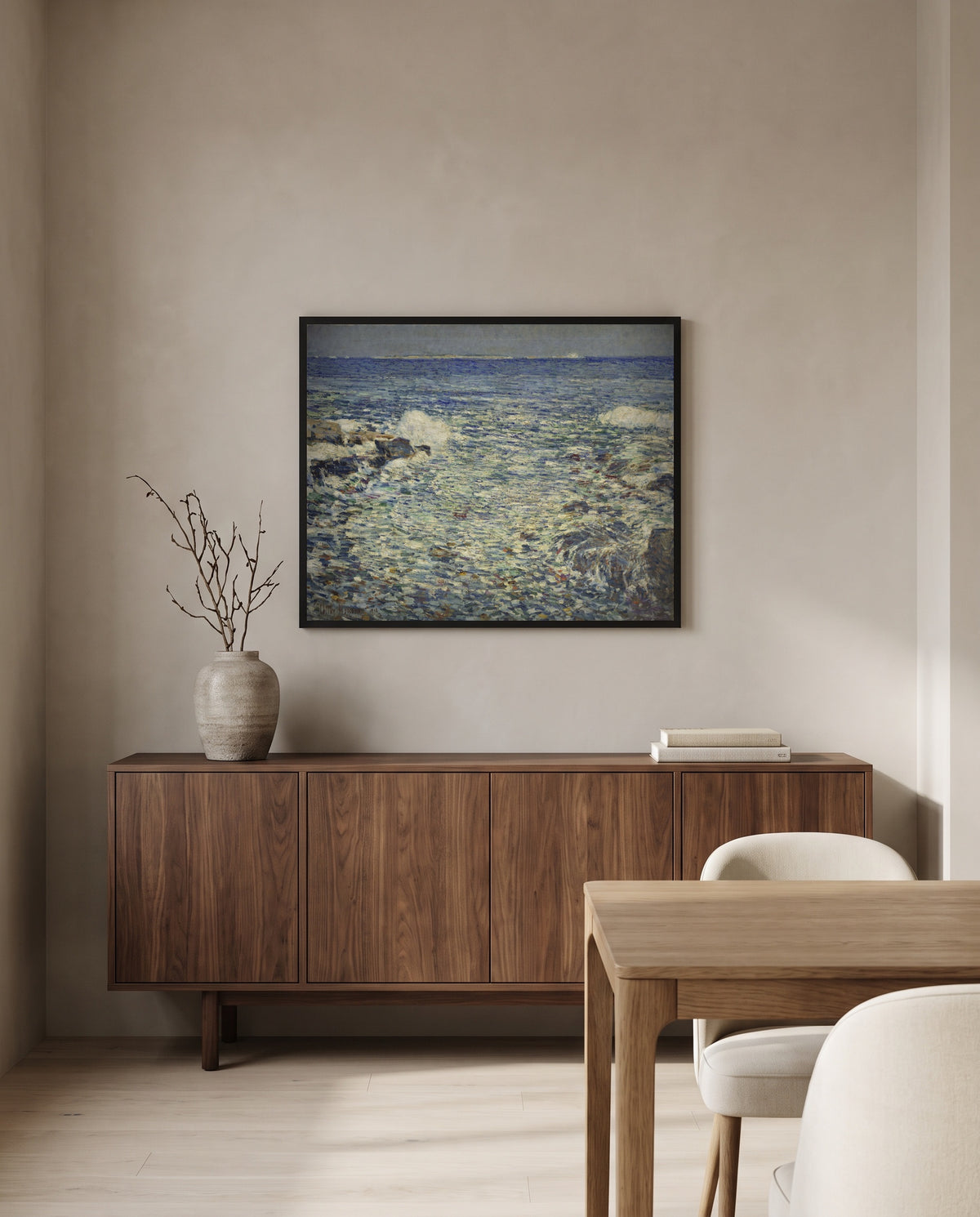 Surf, Isles of Shoals by Childe Hassam in a black frame above a walnut sideboard in a dining room