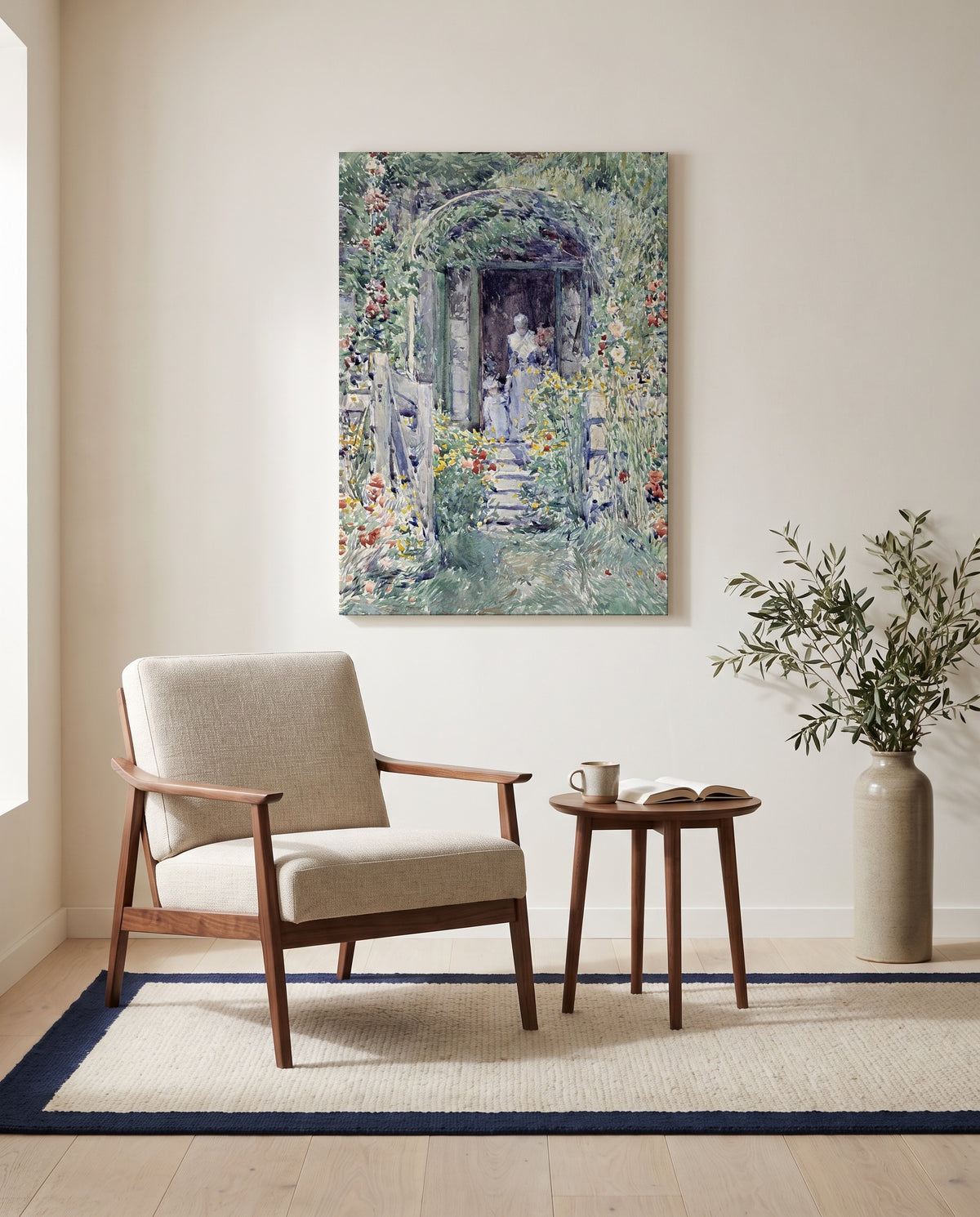 The Garden in Its Glory by Childe Hassam as a stretched canvas above a linen lounge chair in a reading corner