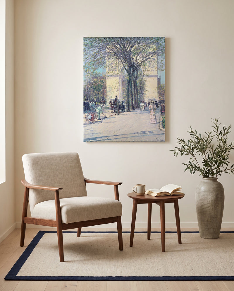 Washington Arch, Spring by Childe Hassam as a stretched canvas above a linen lounge chair in a reading corner