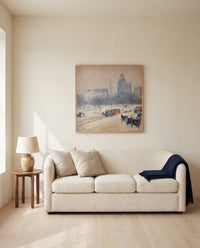 Winter in Union Square by Childe Hassam framed in natural oak above a cream sofa in a warm living room