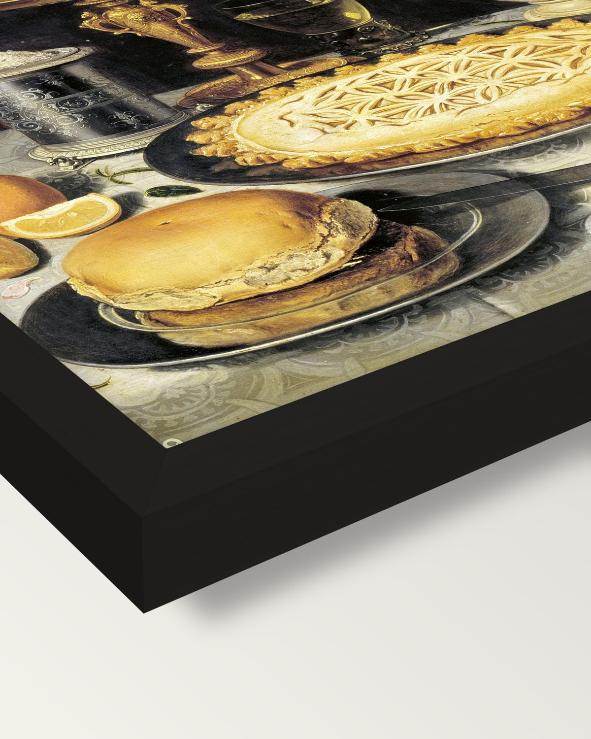 Tazza, Jug and Pie by Clara Peeters framed print, corner close-up: black moulding, mitred, the print set just below its edge