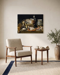 Game and Poultry by Clara Peeters as a stretched canvas above a linen lounge chair in a reading corner