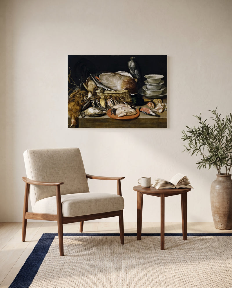 Game and Poultry by Clara Peeters as a stretched canvas above a linen lounge chair in a reading corner