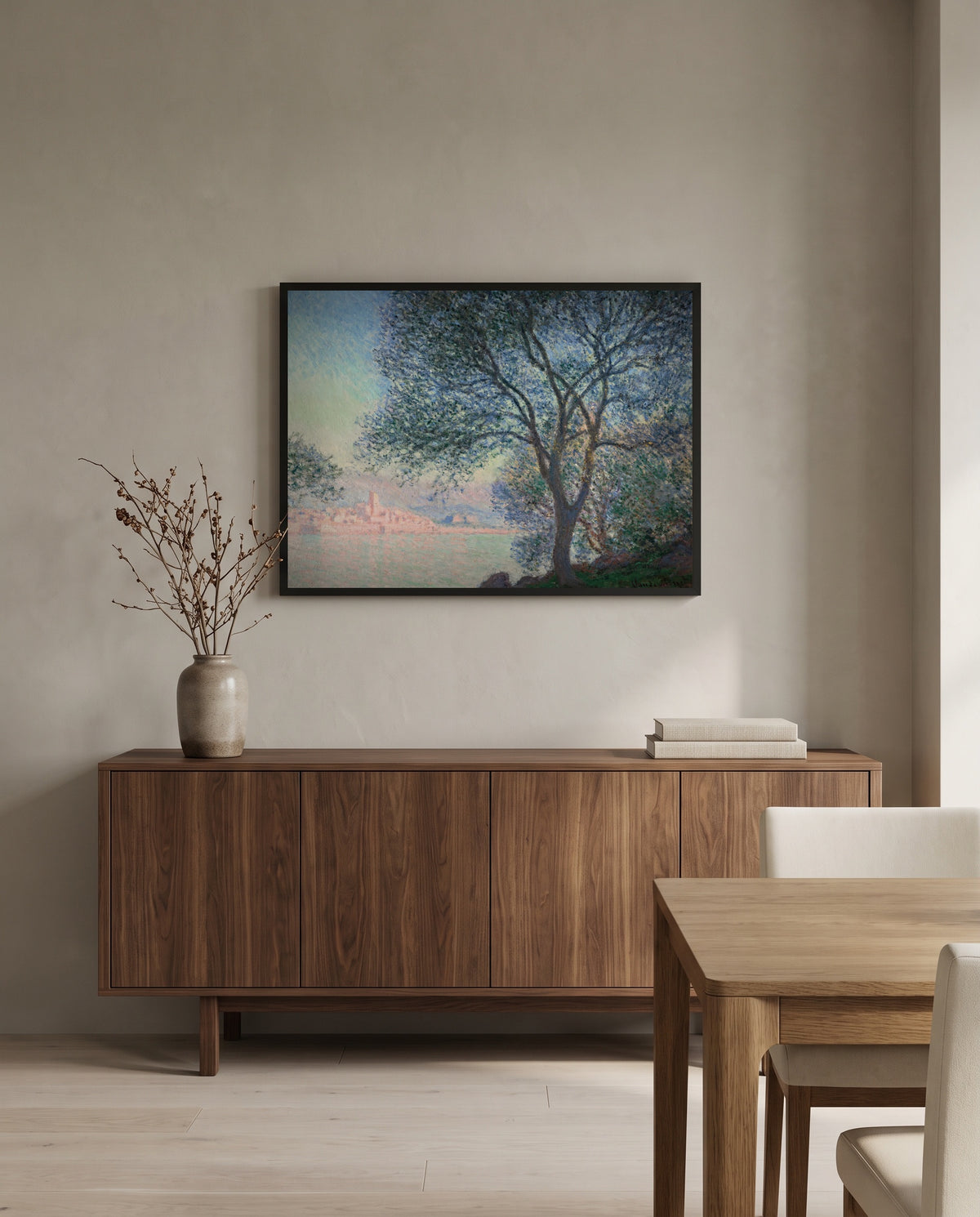Antibes, Salis Gardens by Claude Monet in a black frame above a walnut sideboard in a dining room