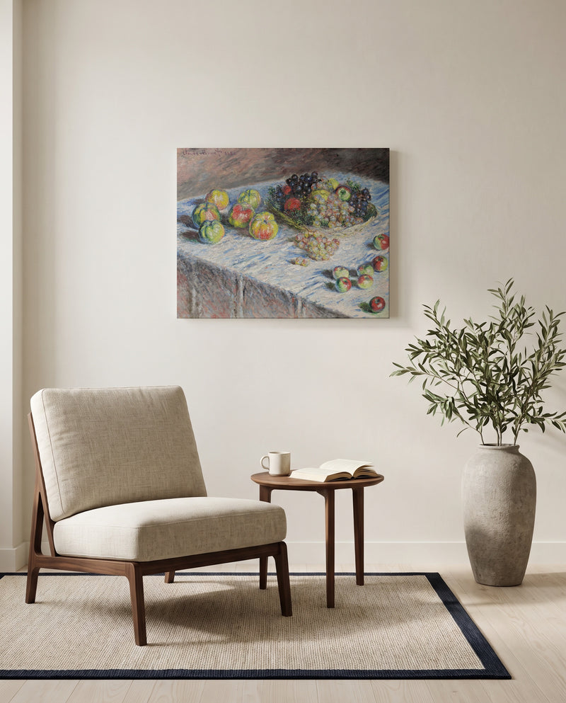 Apples and Grapes by Claude Monet as a stretched canvas above a linen lounge chair in a reading corner