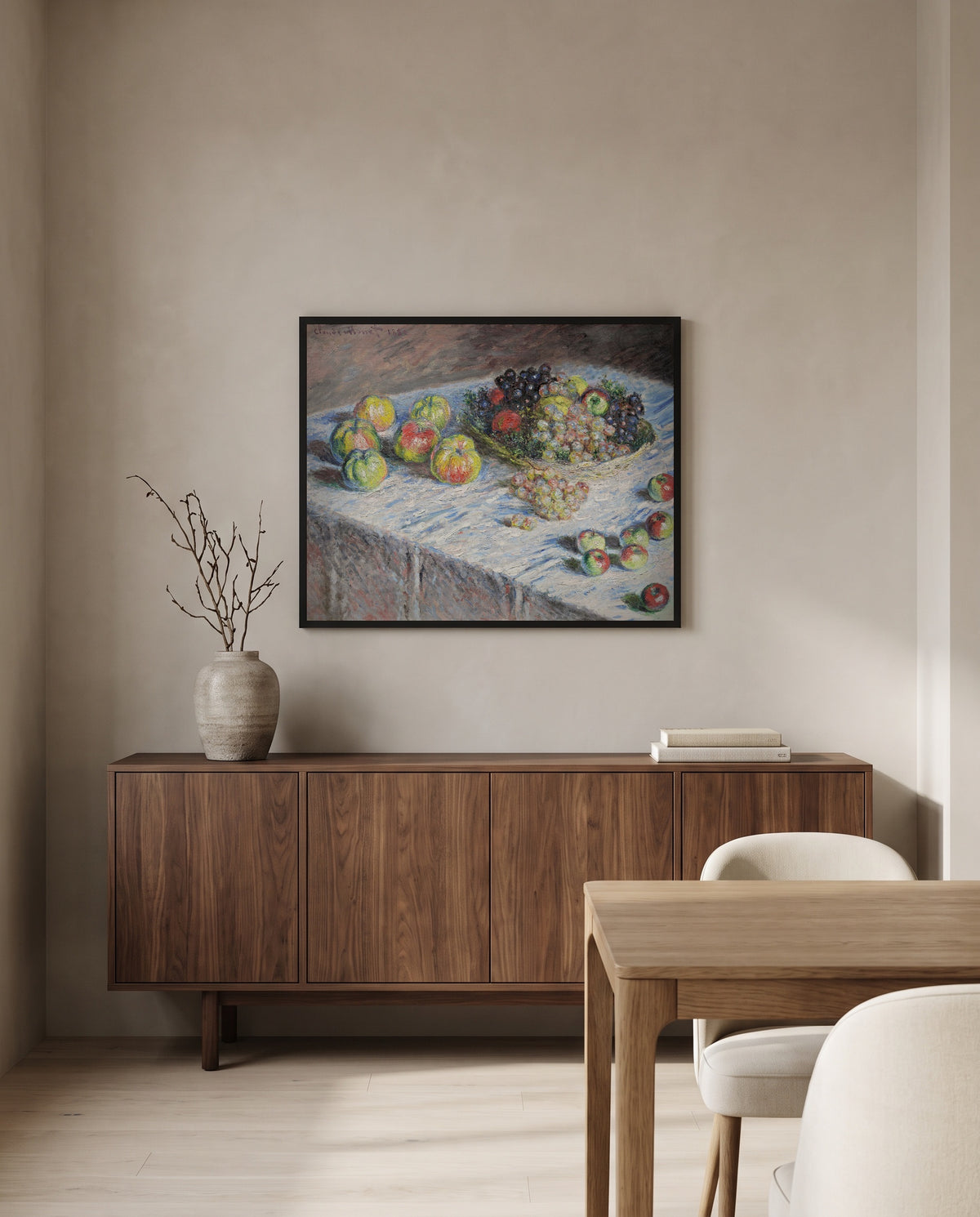 Apples and Grapes by Claude Monet in a black frame above a walnut sideboard in a dining room