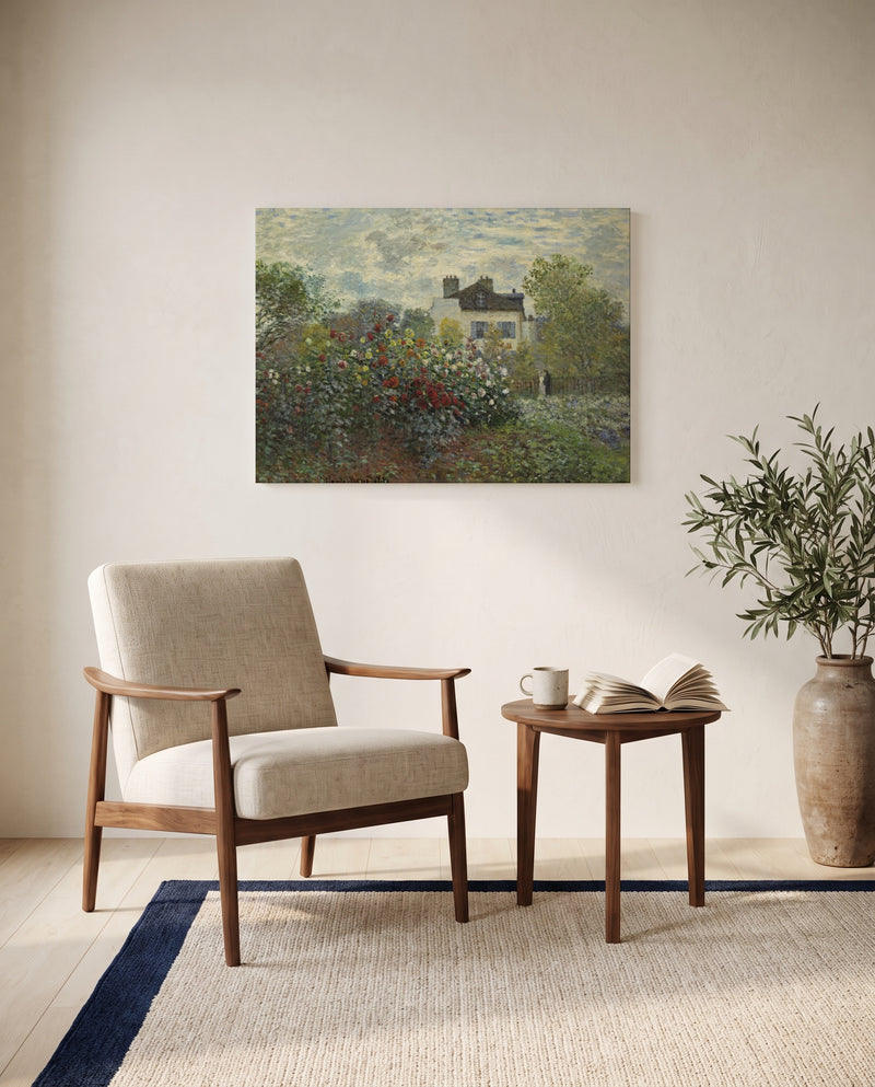 The Artist’s Garden in Argenteuil by Claude Monet as a stretched canvas above a linen lounge chair in a reading corner