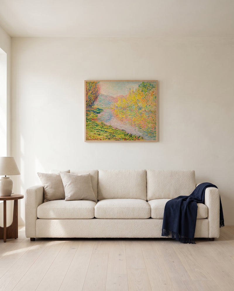 Autumn at Jeufosse by Claude Monet framed in natural oak above a cream sofa in a warm living room