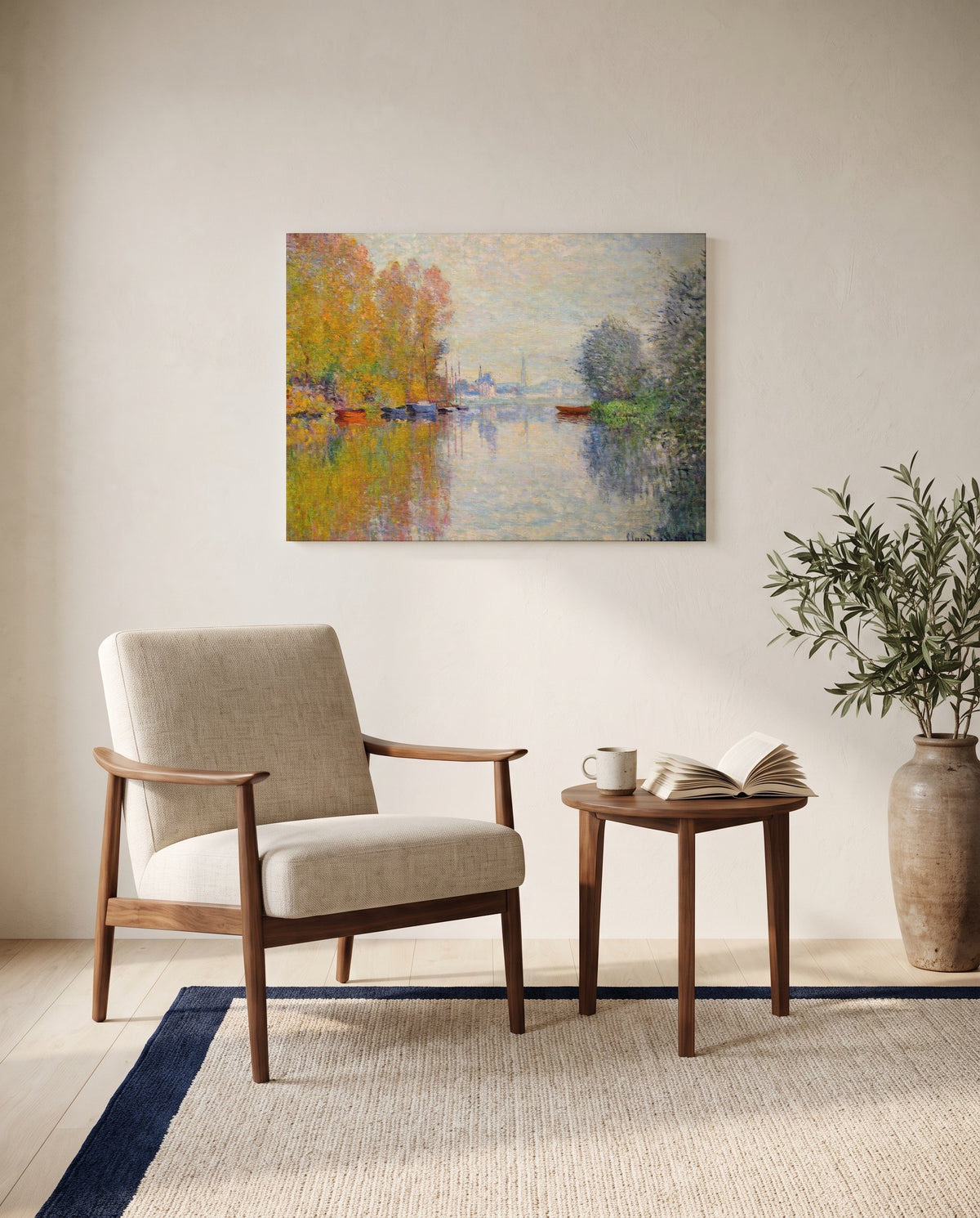 Autumn on the Seine by Claude Monet as a stretched canvas above a linen lounge chair in a reading corner