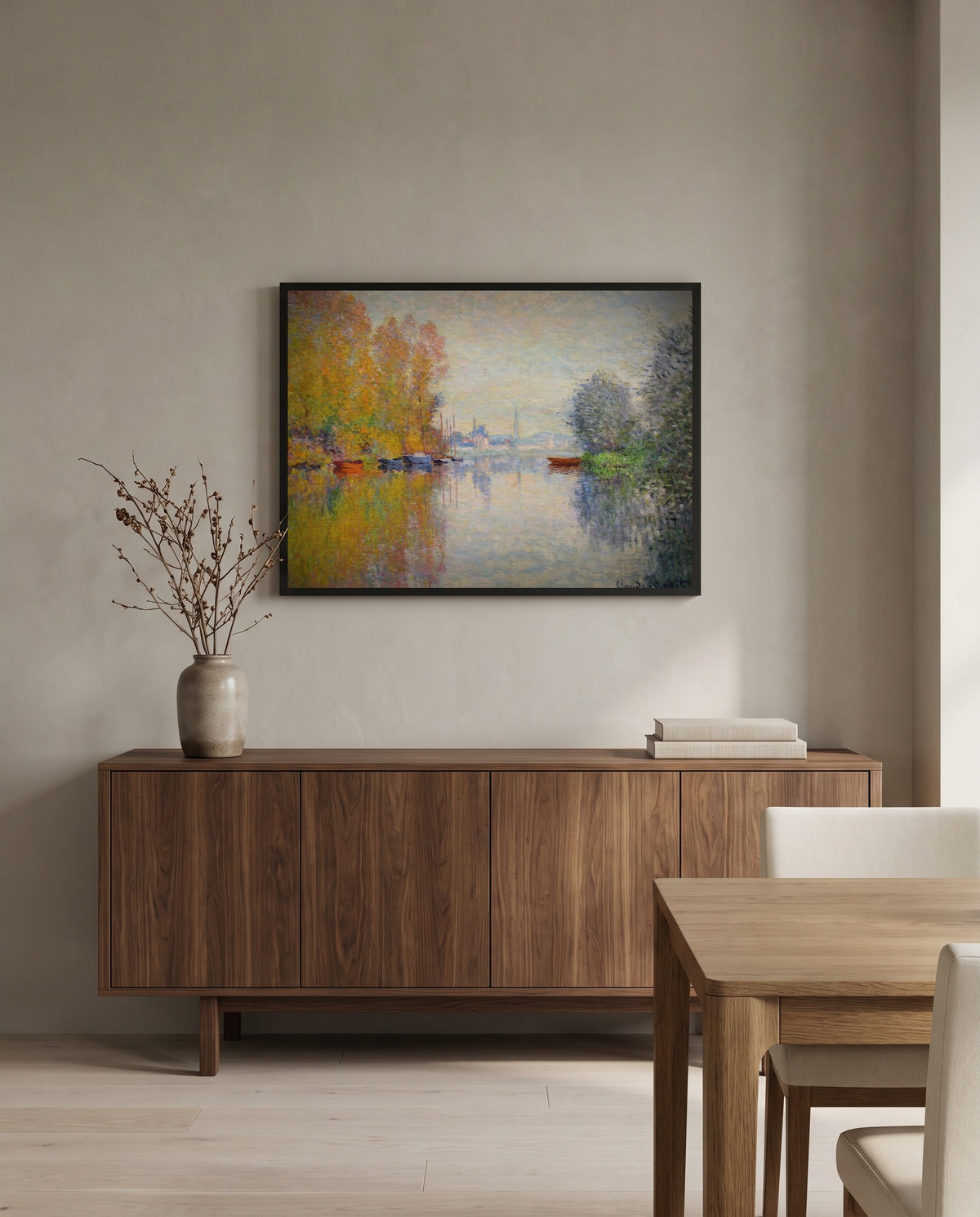 Autumn on the Seine by Claude Monet in a black frame above a walnut sideboard in a dining room