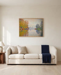 Autumn on the Seine by Claude Monet framed in natural oak above a cream sofa in a warm living room