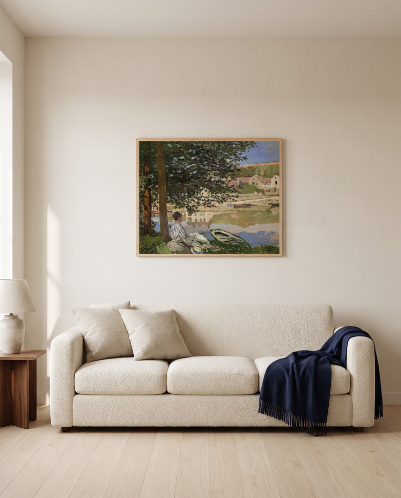 Bank of the Seine, Bennecourt by Claude Monet framed in natural oak above a cream sofa in a warm living room