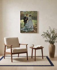 Bazille and Camille by Claude Monet as a stretched canvas above a linen lounge chair in a reading corner