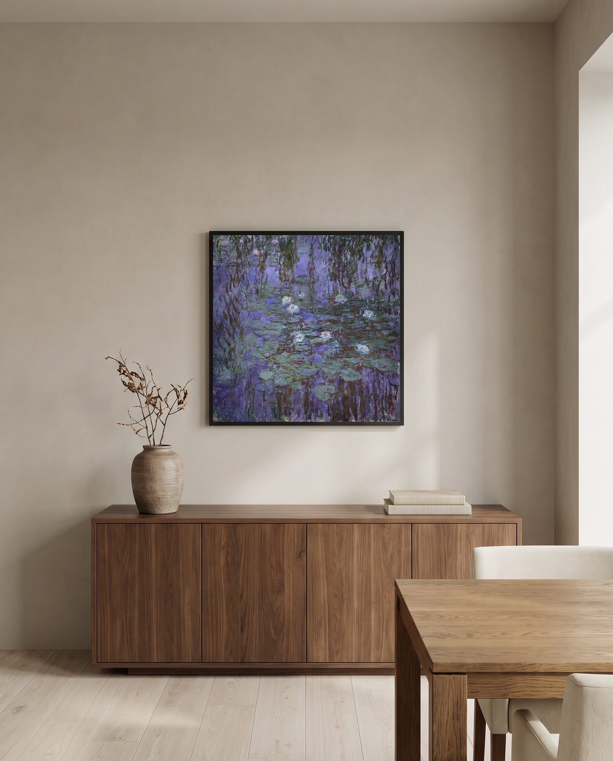 Blue Water Lilies by Claude Monet in a black frame above a walnut sideboard in a dining room