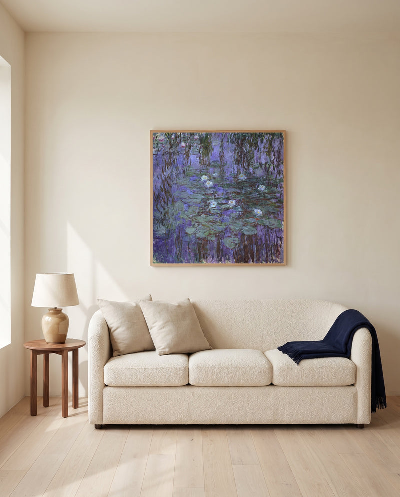 Blue Water Lilies by Claude Monet framed in natural oak above a cream sofa in a warm living room