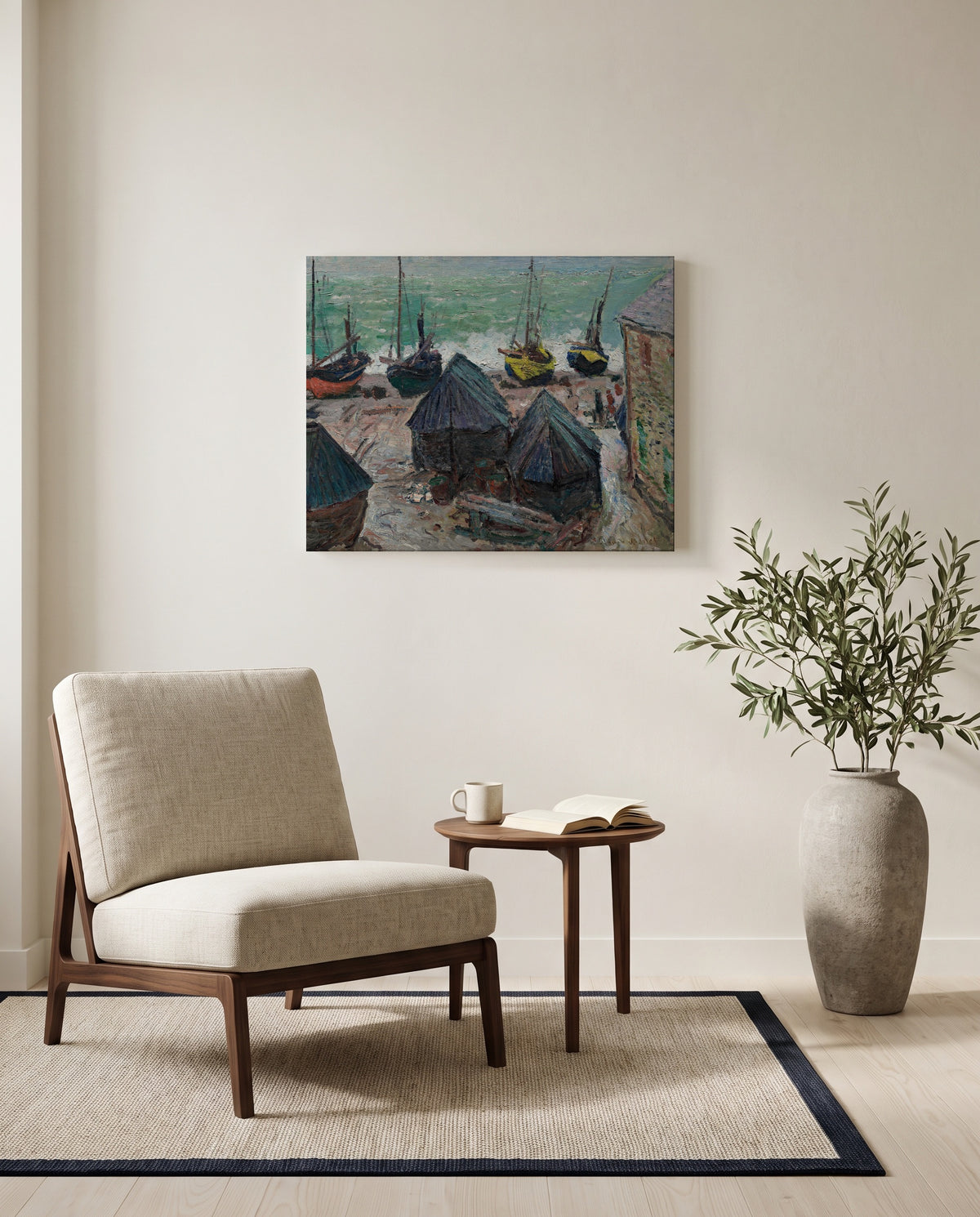 Boats on the Beach at Étretat by Claude Monet as a stretched canvas above a linen lounge chair in a reading corner