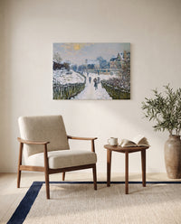 Boulevard Saint-Denis by Claude Monet as a stretched canvas above a linen lounge chair in a reading corner
