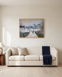 Boulevard Saint-Denis by Claude Monet framed in natural oak above a cream sofa in a warm living room